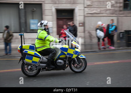 Police motorcyclists in Liverpool, Merseyside, UK  1st December, 2013. Policing the Liverpool Santa Dash starting at the Pier Head and attempting to break the Guinness World Record for the ‘Largest Santa Gathering’ which stands at a staggering 13,000 and also trying to raise to more than last year’s total of £5 million.  Festive Fun Run is backing the ITV Text Santa Appeal this year to help raise funds for Age UK, Anthony Nolan, Carers UK, Marie Curie Cancer Care, together for Short Lives and Whizz-Kidz. Stock Photo