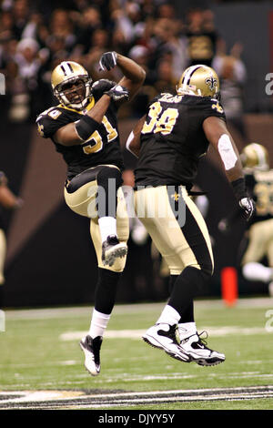 Dec 12, 2010: New Orleans Saints linebacker Jonathan Vilma (51) celebrates withNew Orleans Saints defensive tackle Sedrick Ellis (98) after a pass was run back for a touchdown during game action between the New Orleans Saints and the St. Louis Rams at the Louisiana Superdome in New Orleans, Louisiana. Saints win 31-13. (Credit Image: © Donald Page/Southcreek Global/ZUMAPRESS.com) Stock Photo