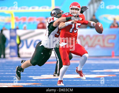 Dec. 18, 2010 - Boise, Idaho, United States of America - Fresno State Bulldogs quarterback Ryan Colburn (15) is tackled from behind by Northern Illinois linebacker Jake Coffman during the first half of action of the uDrive Humanitarian Bowl, at Bronco Stadium in Boise, Idaho (Credit Image: © Brian Lossness/Southcreek Global/ZUMAPRESS.com) Stock Photo