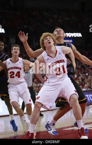 Dec. 23, 2010 - Madison, Wisconsin, U.S - Wisconsin forward Mike Bruesewitz (31) looks to rebound over Coppin State center Ceslovas Kucinskas (50). Wisconsin Badgers defeated the Coppin State Eagles 80-56  at the Kohl Center in Madison, Wisconsin. (Credit Image: © John Fisher/Southcreek Global/ZUMAPRESS.com) Stock Photo