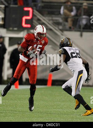 Dec. 28, 2010 - Orlando, Florida, United States of America - North Carolina State Wolfpack wide receiver Darrell Davis (15) catches a pass as West Virginia Mountaineers cornerback Terence Garvin (28) defends during the Champs Bowl game between the North Carolina State University Wolfpack and the West Virginia University Mountaineers Tuesday in Orlando, Fla, December 28, 2010.   The Stock Photo