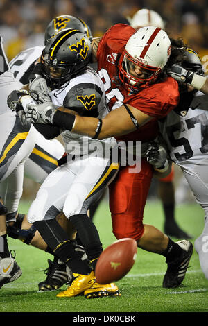 Dec. 28, 2010 - Orlando, Florida, United States of America - North Carolina State Wolfpack defensive tackle Natanu Mageo (90) strips the ball from West Virginia Mountaineers running back Tavon Austin (1) during the game between the West Virginia Mountaineers and the North Carolina State Wolfpack. The Wolfpack defeated the Mountaineers 23-7. (Credit Image: © Jerome Miron/Southcreek  Stock Photo