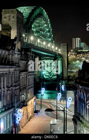 Photograph of the Quayside at Newcastle upon Tyne, England, with the famous Tyne Bridge placed prominently in the photo. Stock Photo