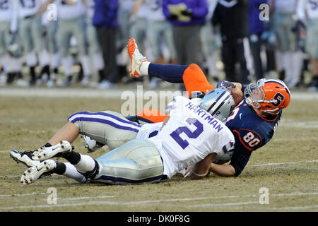 Dec. 31, 2010 - Bronx, New York, United States of America - Syracuse Orange tight end Nick Provo (80) is brought to the ground while trying to make the catch by Kansas State Wildcats cornerback Tysyn Hartman (2) and Kansas State Wildcats linebacker Alex Hrebec (56) in the first quarter. Syracuse defeated Kansas State 36-34 to win the inaugural New Era Pinstripe Bowl at Yankee Stadi Stock Photo