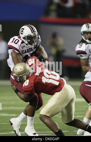 Dec. 31, 2010 - Atlanta, Georgia, United States of America - Dec 31, 2010: South Carolina running back Brian Maddox runs to the outside before being stopped by Florida State safety Nick Moody. (Credit Image: © Jeremy Brevard/Southcreek Global/ZUMAPRESS.com) Stock Photo