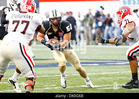 Dec. 31, 2010 - Memphis, Al, U.S - Georgia Bulldogs safety Bacarri Rambo  (18) makes an open field tackle on UCF Knights wide receiver Jamar Newsome  (9) during 2nd half action of