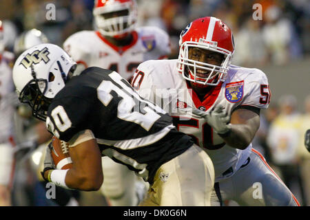 Dec. 31, 2010 - Memphis, Al, U.S - Georgia Bulldogs safety Bacarri Rambo  (18) makes an open field tackle on UCF Knights wide receiver Jamar Newsome  (9) during 2nd half action of