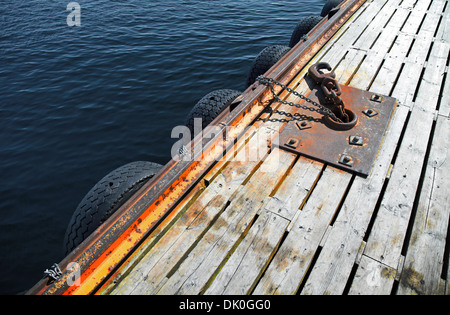 Mooring equipment on wooden pier in Norway Stock Photo