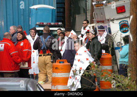 Bronx, New York, USA. 1st Dec 2013. Some injured people wait at the site of a train derailment in New York borough of Bronx, on Dec. 1, 2013. At least four people died and 63 injured in the derailment happened before 7:30 a.m. Sunday morning near the Spuyten-Dryvil Station Credit:  Xinhua/Alamy Live News Stock Photo