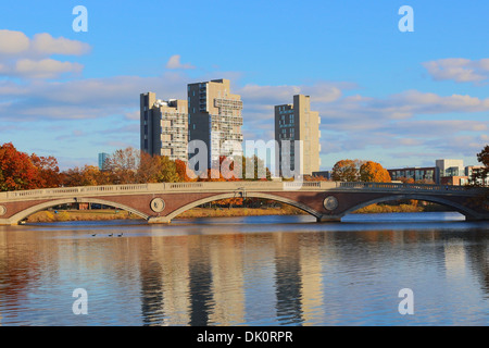 Harvard University owned apartment towers Peabody Terrace and Weeks Footbridge on Charles River in Fall in Cambridge, MA, USA. Stock Photo