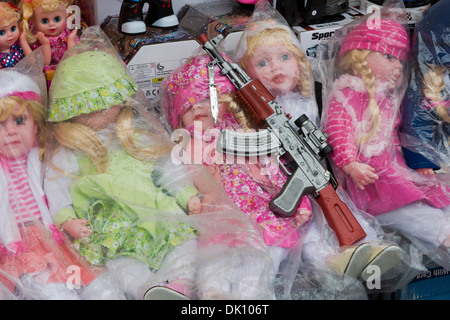 Porta Portese flea market, dolls and a machine gun on sale, Via Portuense, Rome, Italy Stock Photo