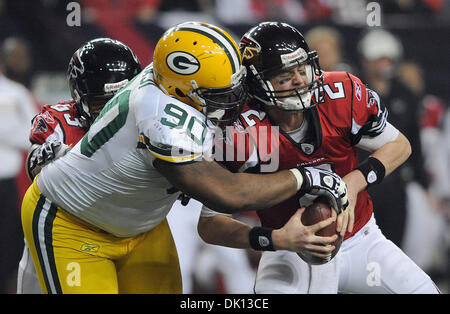 Jan. 15, 2011 - Atlanta, GEORGIA, U.S. - Atlanta Falcons tight end Tony  Gonzalez (L) winces in pain while being tackled by Green Bay Packers  linebacker Desmond Bishop during the second half