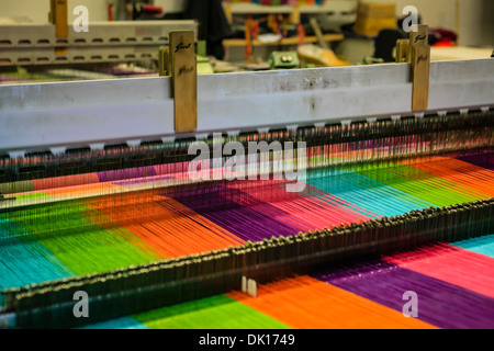 Modern weaving machine producing elaberate patterned textile for the World markets Stock Photo