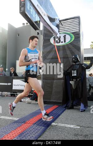Jan 16, 2011 - Venice Beach, California, U.S. - Darth Vador cheers as a runner goes by. Thousands of runners participate in the 2nd annual 13.1 Marathon - Los Angeles and Karhu 5k Race. (Credit Image: © Ringo Chiu/ZUMAPRESS.com) Stock Photo