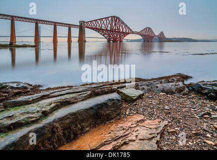 The Forth Rail and Road Bridges on a relatively calm cloudy day as seen from South Queensferry, Scotland