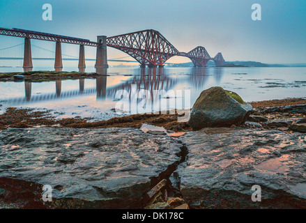The Forth Rail and Road Bridges on a relatively calm cloudy day as seen from South Queensferry, Scotland