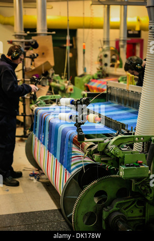 Modern weaving machine producing elaberate patterned textile for the World markets Stock Photo