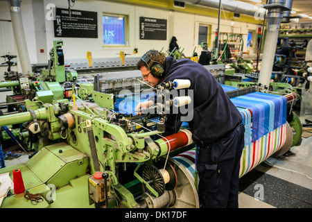 Modern weaving machine producing elaberate patterned textile for the World markets Stock Photo