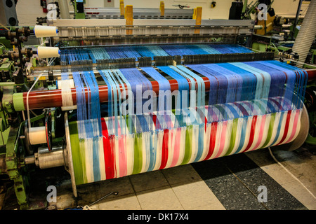 Modern weaving machine producing elaberate patterned textile for the World markets Stock Photo