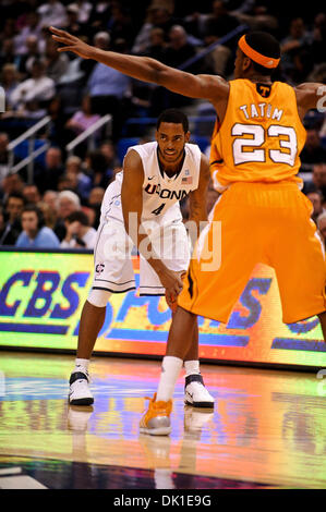 Jan. 22, 2011 - Hartford, Connecticut, United States of America - Connecticut F Jamal Coombs-McDaniel (4) looks for the open man around Tennessee defender Cameron Tatum (23). Connecticut defeats Tennessee 72 - 61 at the XL Center. (Credit Image: © Geoff Bolte/Southcreek Global/ZUMAPRESS.com) Stock Photo