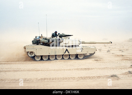 A US Army M-1A1 Abrams main battle tank from the 3rd Brigade, 1st Armored Division, moves across the desert in northern Kuwait during Operation Desert Storm February 28, 1991 in Kuwait. Staff Sgt. Robert Reeve Stock Photo