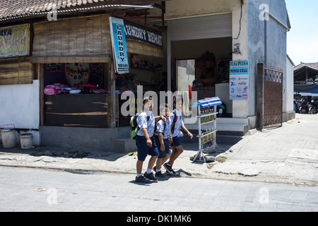 Three Indonesian boys walking to school Stock Photo