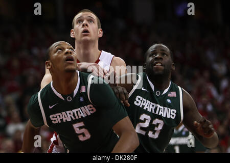 Feb. 6, 2011 - Madison, Wisconsin, U.S - Wisconsin forward Jon Leuer (30) is blocked out by Michigan State Michigan State center Adreian Payne (5) and  forward Draymond Green (23). In Big Ten action the Wisconsin Badgers defeated the Michigan State Spartans 82-56 at the Kohl Center in Madison, Wisconsin. (Credit Image: © John Fisher/Southcreek Global/ZUMAPRESS.com) Stock Photo