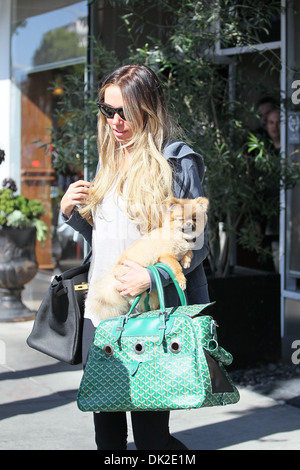 Petra Ecclestone leaving an office building Beverly Hills carrying her Pomeranian puppy Los Angeles California - 10.04.12 Stock Photo