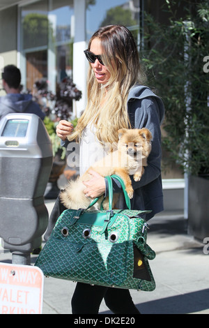 Petra Ecclestone leaving an office building Beverly Hills carrying her Pomeranian puppy Los Angeles California - 10.04.12 Stock Photo