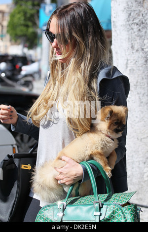 Petra Ecclestone leaving an office building Beverly Hills carrying her Pomeranian puppy Los Angeles California - 10.04.12 Stock Photo