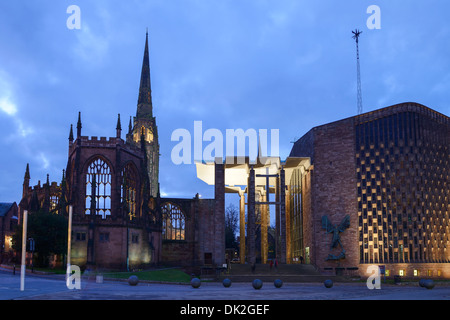 The old Coventry Cathedral alongside the New Cathedral at dusk Stock Photo