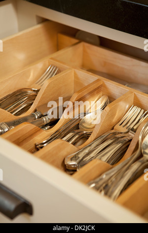 Close up high angle view of open organized silverware drawer Stock Photo