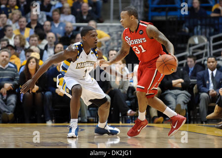 Feb. 15, 2011 - Milwaukee, Wisconsin, USA - St. John's guard Malik Stith (31) looks to dribble the ball past Marquette guard Darius Johnson-Odom (1) during the game between the Marquette Golden Eagles and the St. John's Red Storm at the Bradley Center in Milwaukee, WI.  St. John's defeated Marquette 80-68. (Credit Image: © John Rowland/Southcreek Global/ZUMAPRESS.com) Stock Photo