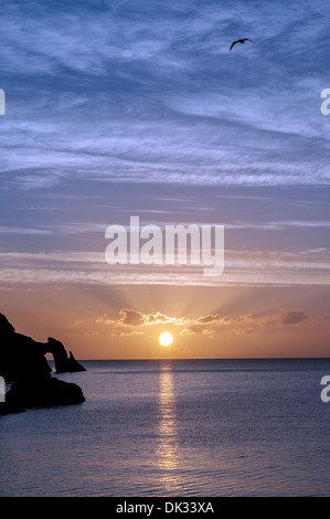 sunrise over Torquay,Devon,a natural arch of limestone called London Bridge,sunset, sky, beach, ocean, sea, shore, sun, dusk, wa Stock Photo