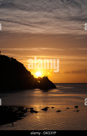 sunrise over Torquay,Devon,a natural arch of limestone called London Bridge,sunset, sky, beach, ocean, sea, shore, sun, dusk, wa Stock Photo