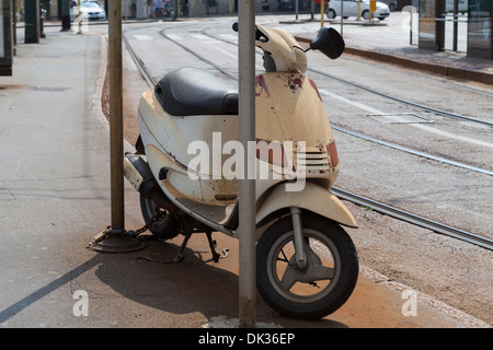 Old motor bike on the street, Milan,Italy Stock Photo