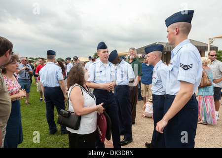 New airmen visiting with parents after United States Air Force basic training graduation ceremonies In San Antonio, Texas Stock Photo