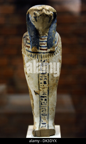 Qebehsenuef, son of Horus. Protective deity. Depicting as a human mummify body with falcon head. Wood. Late Period. 746-332 BC. Stock Photo