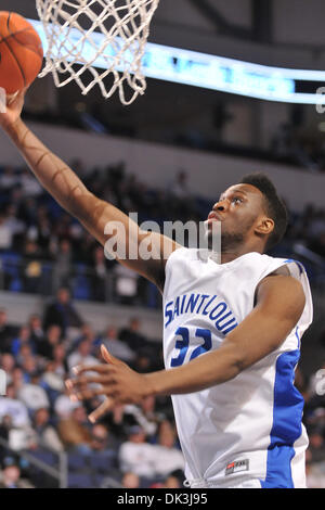 Cory Remekun (32) of the Saint Louis Billikens blocks a two point shot ...