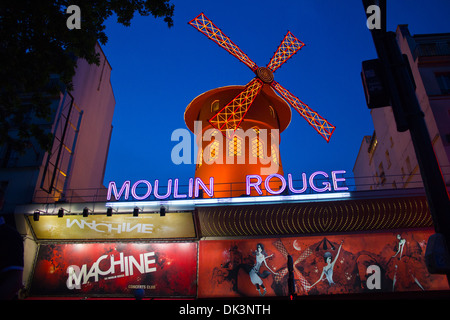 Moulin Rouge, Paris – The Moulin Rouge at dusk, lit up in Neon. Stock Photo