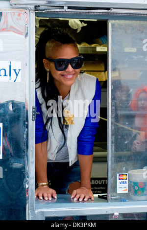 Cassie Ventura hands out icream sandwiches from Coolhaus ice cream cart in Manhattan New York City USA - 23.04.12 Stock Photo