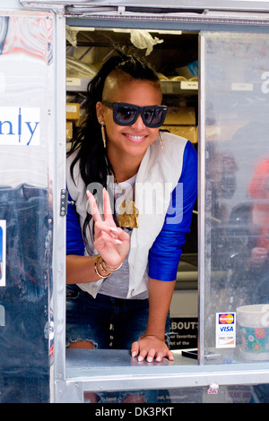 Cassie Ventura hands out icream sandwiches from Coolhaus ice cream cart in Manhattan New York City USA - 23.04.12 Stock Photo