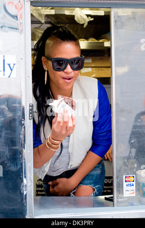 Cassie Ventura hands out icream sandwiches from Coolhaus ice cream cart in Manhattan New York City USA - 23.04.12 Stock Photo