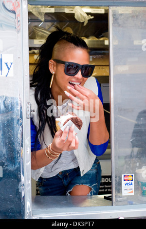 Cassie Ventura hands out icream sandwiches from Coolhaus ice cream cart in Manhattan New York City USA - 23.04.12 Stock Photo