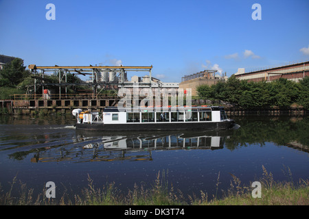 The Anderton Lift trip boat on the river Weaver next to Tata Chemicals Europe site and the Anderton Lift at Winnington, Northwic Stock Photo