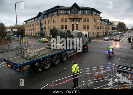 Glasgow, Scotland. 2nd December 2013. Police escort a lorry carrying the police helicopter from the The Clutha bar where it crashed last Friday  in Glasgow, Scotland. A ninth body has been recovered in the wreckage of Glasgow's Clutha pub which was destroyed when a police helicopter crashed on to the roof of it on Friday night. Credit:  Sam Kovak/Alamy Live News Stock Photo