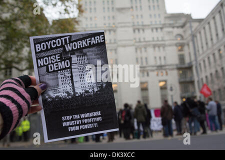 London, UK. 2nd Dec, 2013. Protesters take part in a noise demo to oppose Workfare, a government policy whereby individuals must undertake work in return for their benefit payments or risk losing them. Protesters were demanding an end to the scheme, labelling the practice as exploitative, as politicians companies and charities involved in implementing workfare came together at Senate House for an annual conference. Credit:  Patricia Phillips/Alamy Live News Stock Photo
