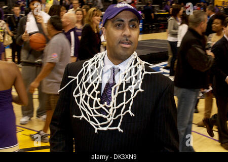 Mar. 12, 2011 - Los Angeles, California, United States of America - Washington Huskies head coach Lorenzo Romar looks for friends and family while wearing the nets he had just cut down signifying the Washington Huskies Pac-10 Tournament Championship. (Credit Image: © Tony Leon/Southcreek Global/ZUMAPRESS.com) Stock Photo