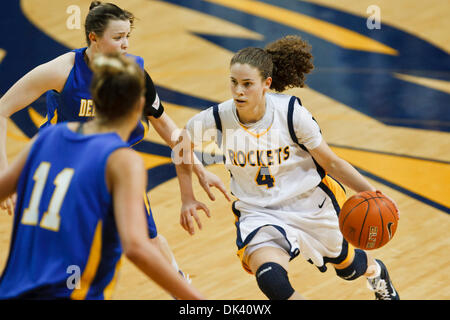 Mar. 16, 2011 - Toledo, Ohio, U.S - Toledo guard Naama Shafir (#4) drives to the basket against Delaware guard Meghan McLean (#4) and Elena Delle Donne (#11) during second-half game action.  The Toledo Rockets, of the Mid-American Conference, defeated the Delaware Blue Hens, of the Colonial Athletic Association, 58-55 in the first round game of the 2011 Women's National Invitationa Stock Photo