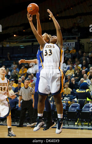 Mar. 16, 2011 - Toledo, Ohio, U.S - Toledo center Yolanda Richardson (#33) and Delaware forward Elena Delle Donne (#11) battle for a rebound during first-half game action.  The Toledo Rockets, of the Mid-American Conference, defeated the Delaware Blue Hens, of the Colonial Athletic Association, 58-55 in the first round game of the 2011 Women's National Invitational Tournament being Stock Photo